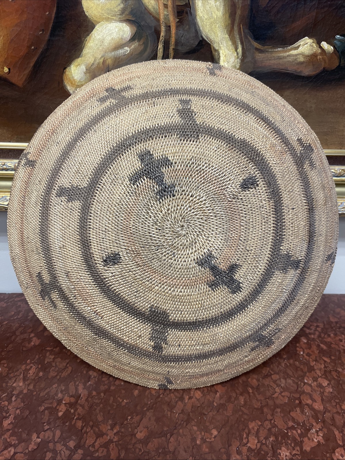 Woven Apache pictorial 17 1/4” basket with geometric and symbolic designs.