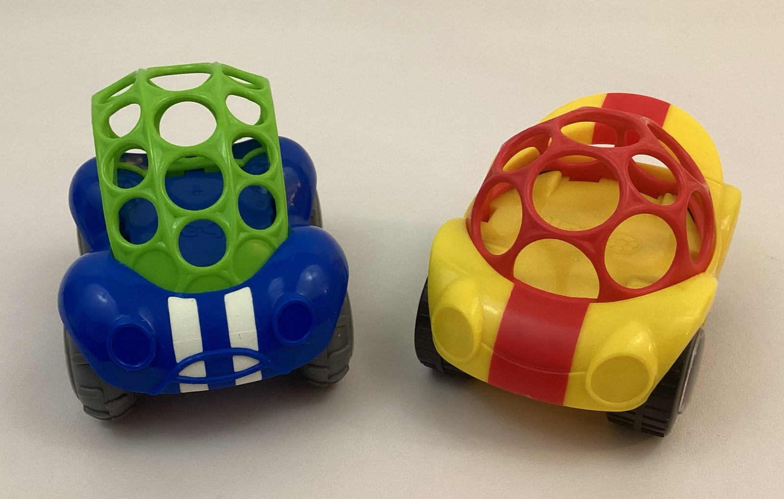 Oball Go Grippers Rattle Roll Race Sports Cars Lot of 2 Yellow Blue Toys