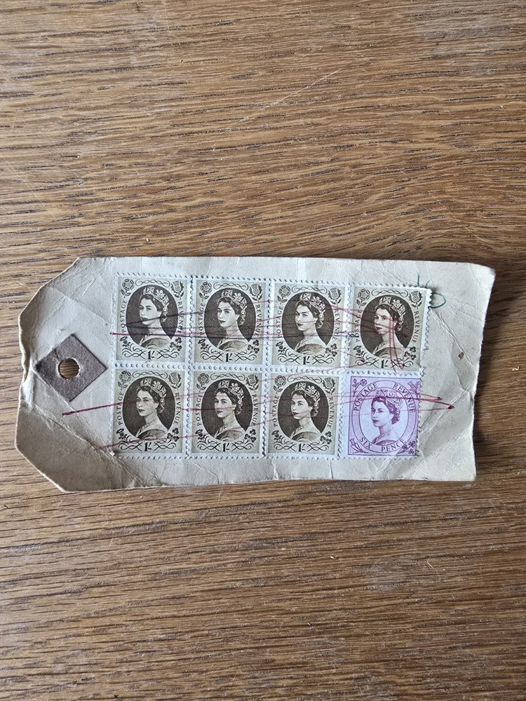 Queen Elizabeth One Shilling + Sixpence Stamps.