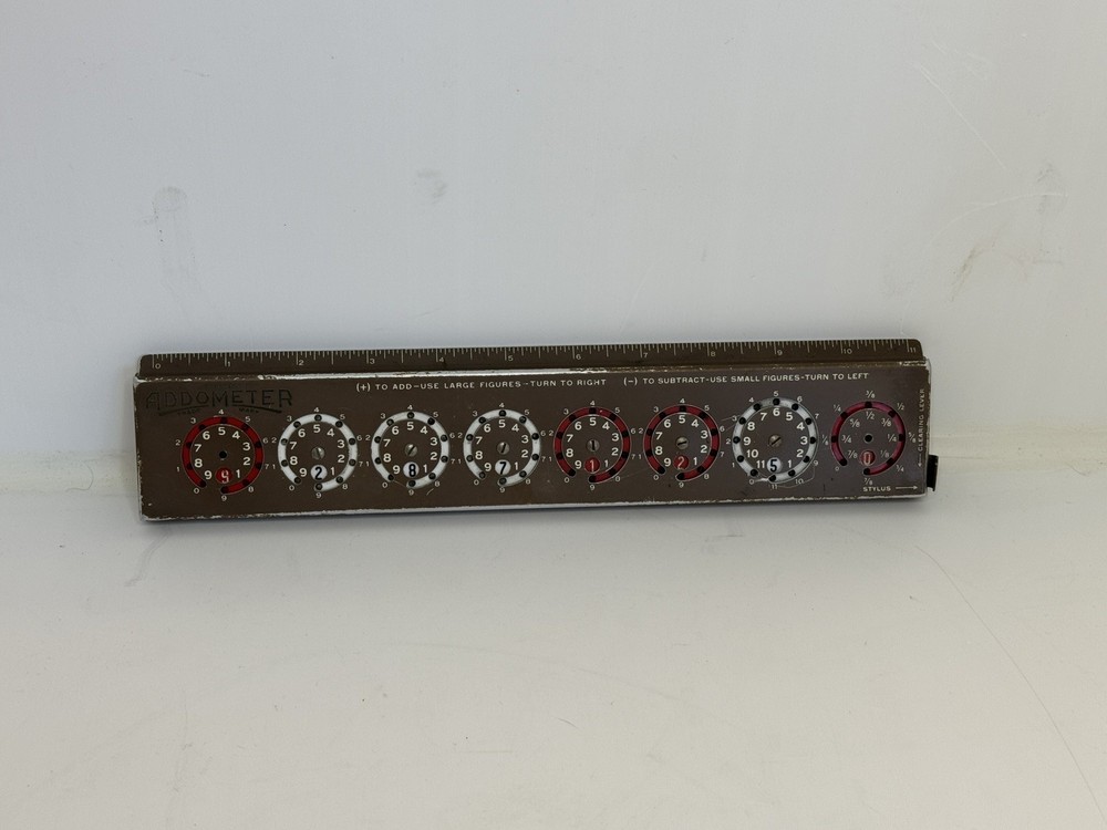Addometer stylus-operated adding machine. Vintage mechanical calculator.