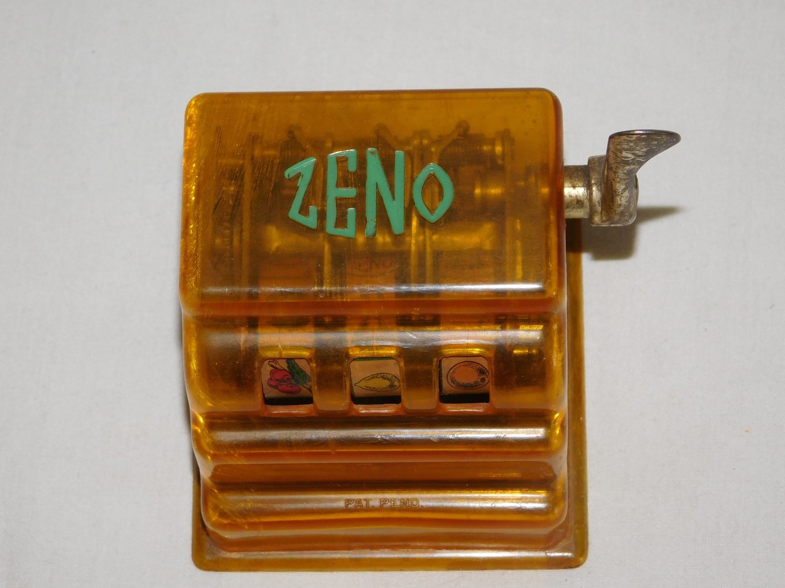 VINTAGE TRADE STIMULATOR 3 1/4" HIGH ZENO TOY SLOT MACHINE