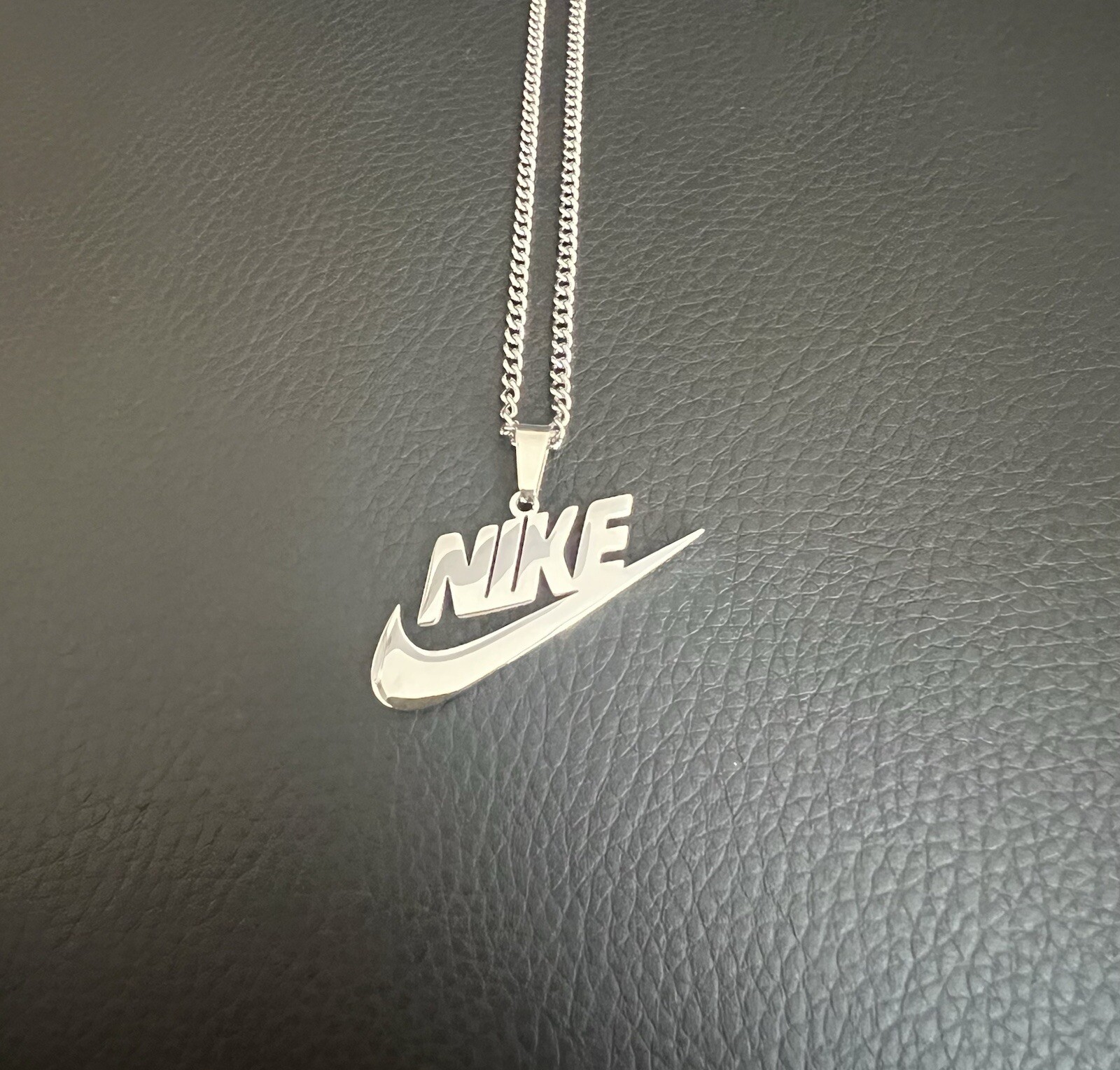 Nike Swoosh Pendant Necklace 20 in Silver Plated Stainless Steel