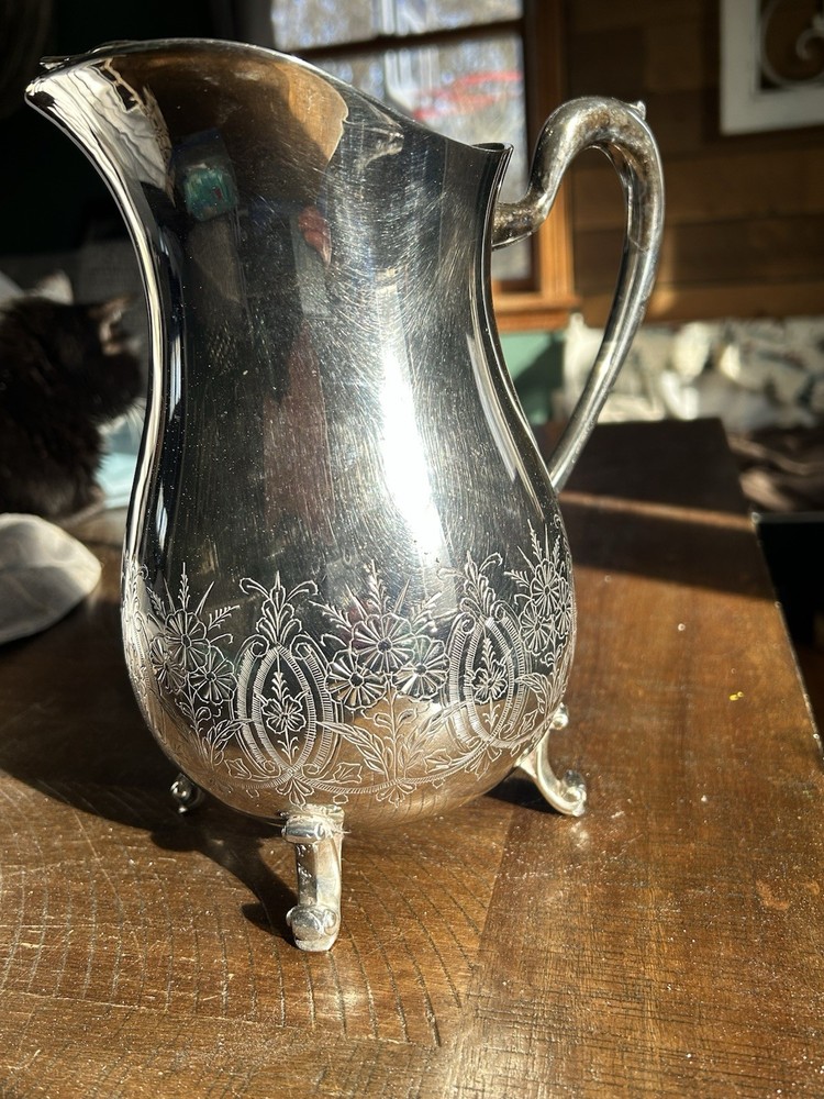 Vintage Leonard silver-plated pitcher with engraved floral pattern.