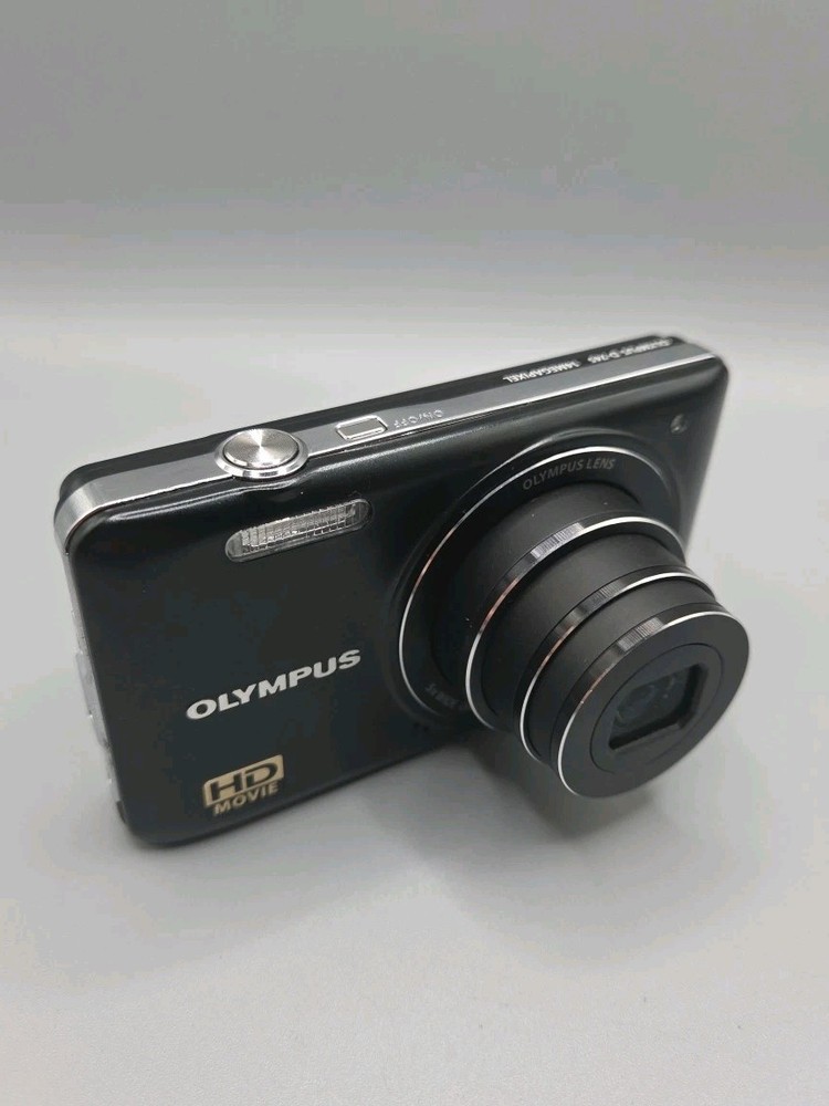 Olympus D-745 Digital Camera And Charging Lead, Black.