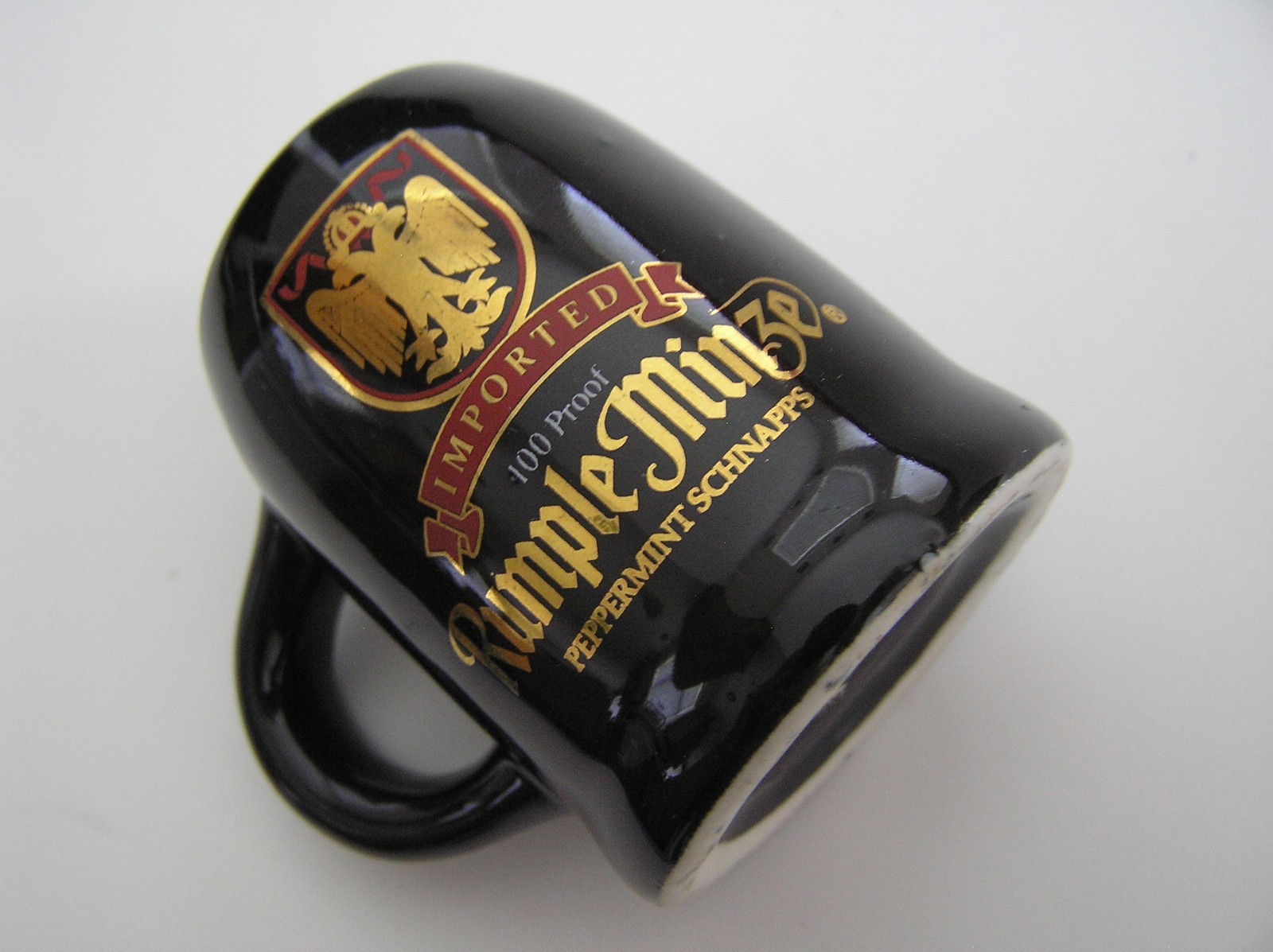 2 Souvenirs Shot Mugs: A Black Rumple Minze and A Clear Nashville 5cents Beer