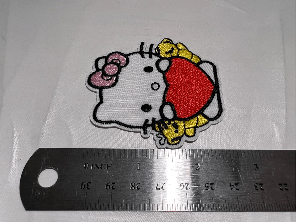 Hello Kitty Holding a Heart Iron on Patch