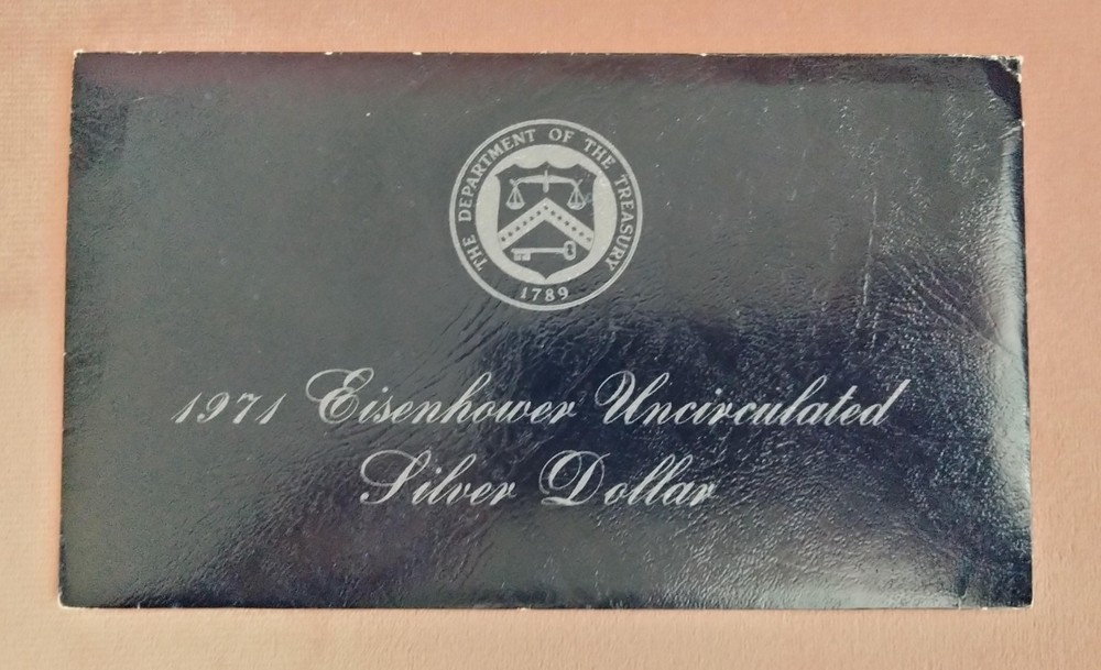 1971 Eisenhower Uncirculated Silver Dollar coin with envelope
