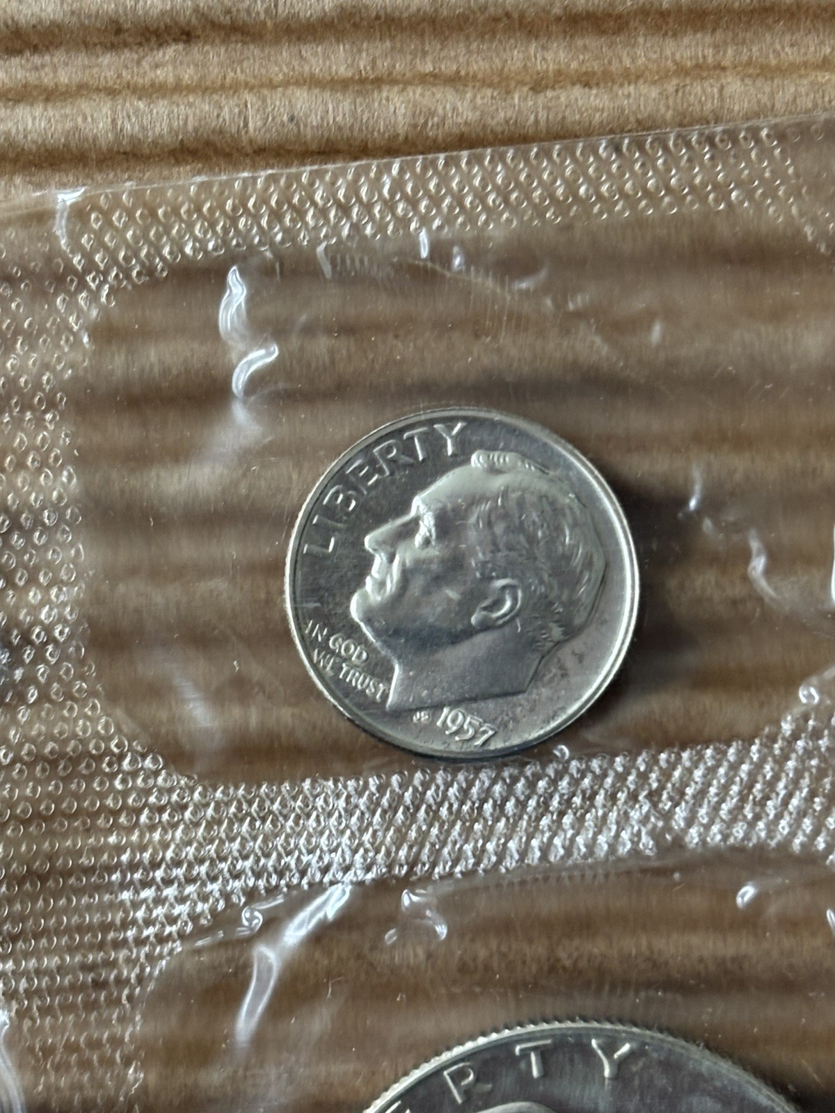 1957 U.S. PROOF SET. Coins U.S. Mint Sealed in a flat cello. (Tear in envelope)