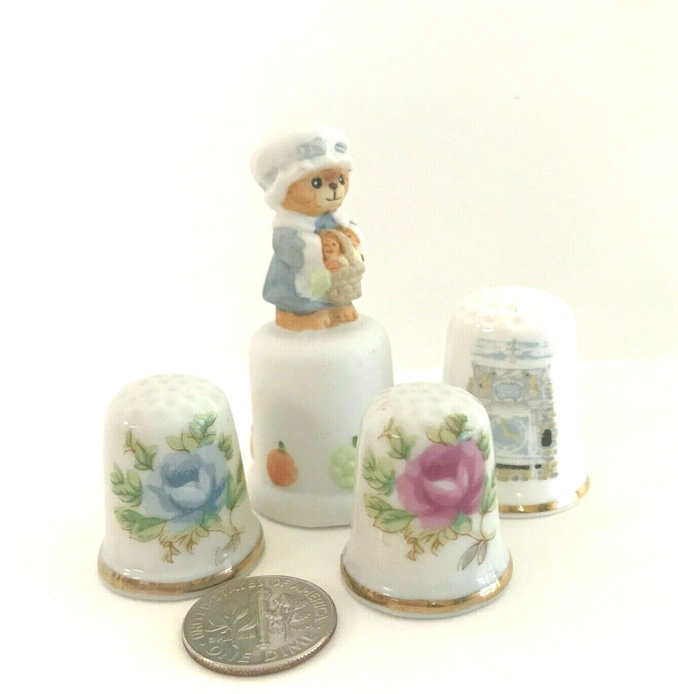 FOUR COLLECTABLE  CERAMIC  THIMBLES