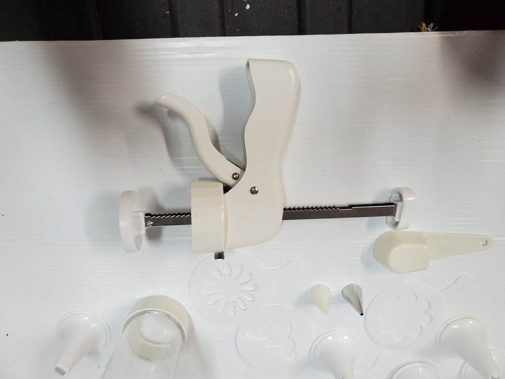 White plastic Cookie Press Disc Cutouts -with extras