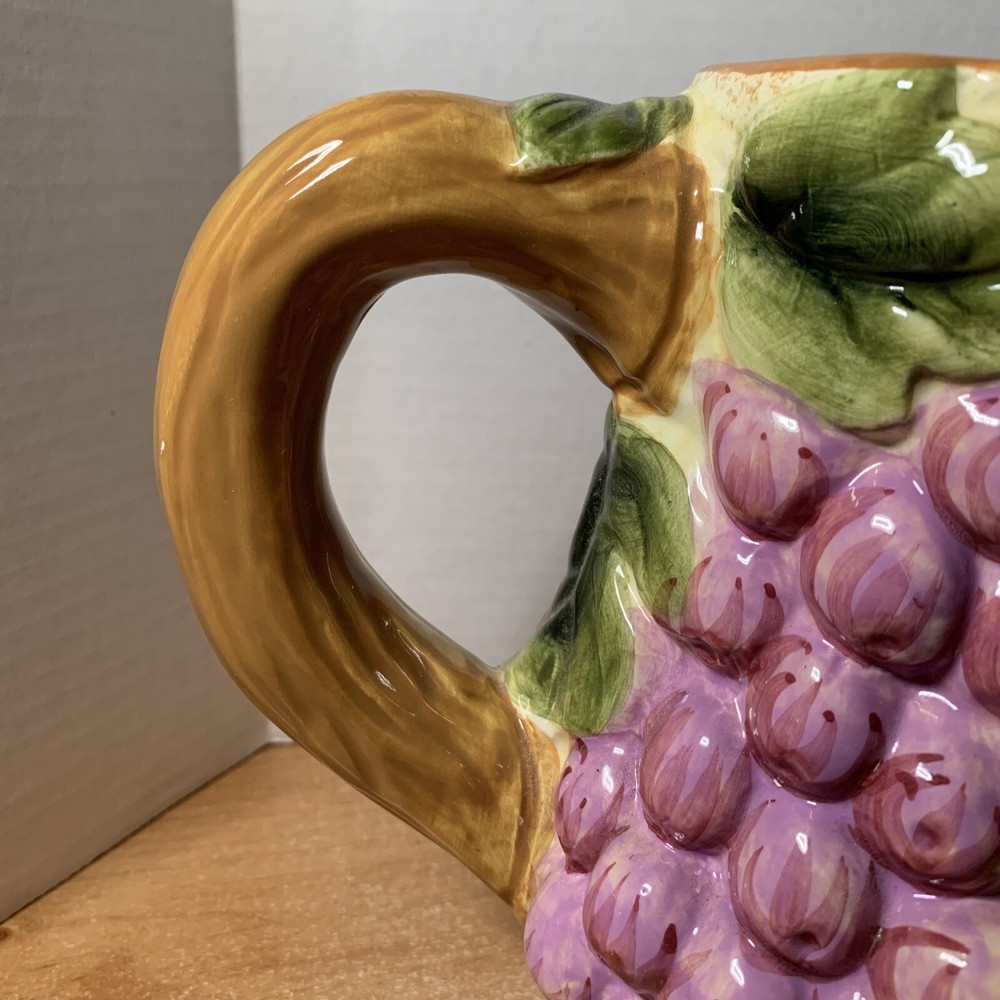 Baum Bros Style Eyes Raised Fruit Pitcher Pineapple Grapes, Apples 7"