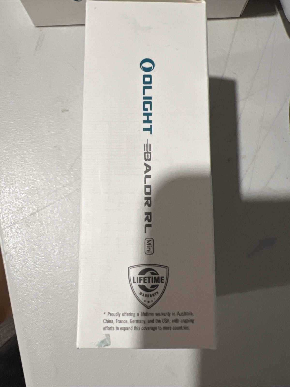 Olight Baldr RL Mini 600 Lumen Tactical Light - Black - Red Beam Laser