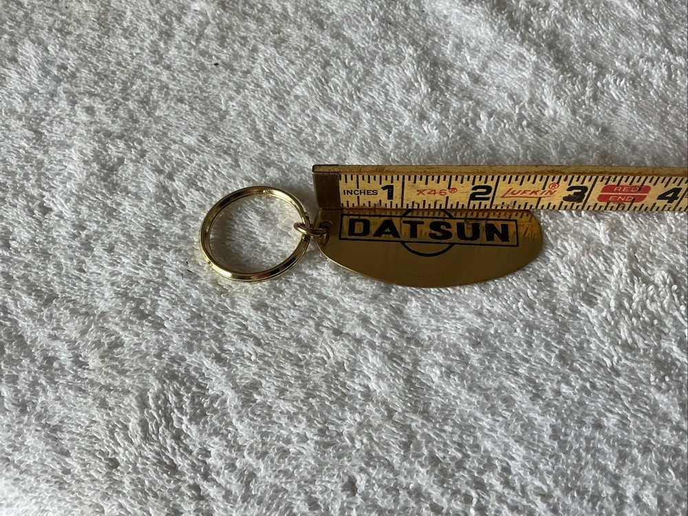 Brass Datsun Keychain, 2.5”x1.5” , Nice Shape