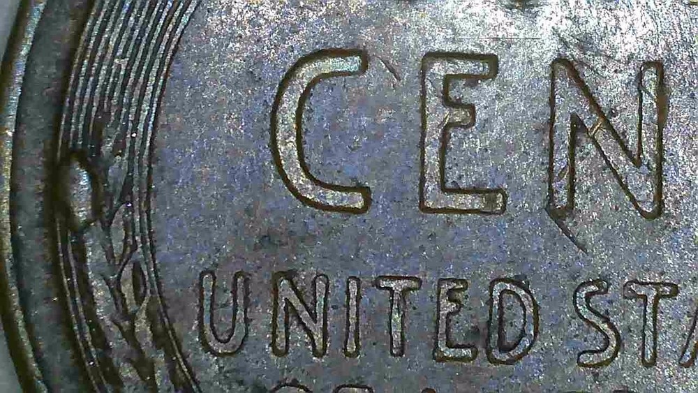 1958 P lincoln penny with 2 cuds errors on reverse wheats.