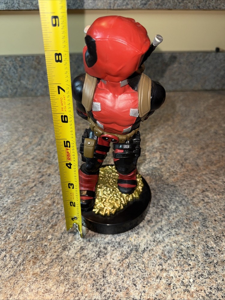 Deadpool controller/phone holder. Marvel Cableguys. Good shape. About 9 " High.
