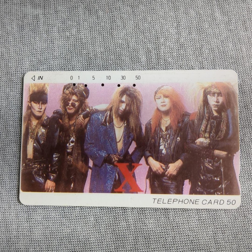 X Used telephone card hide card