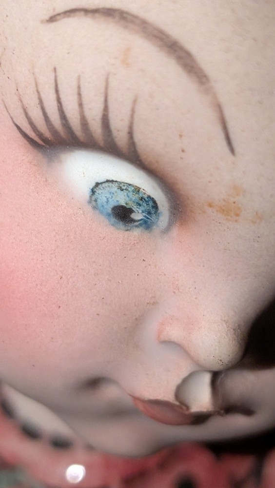 Old, vintage, and potentially haunted doll.