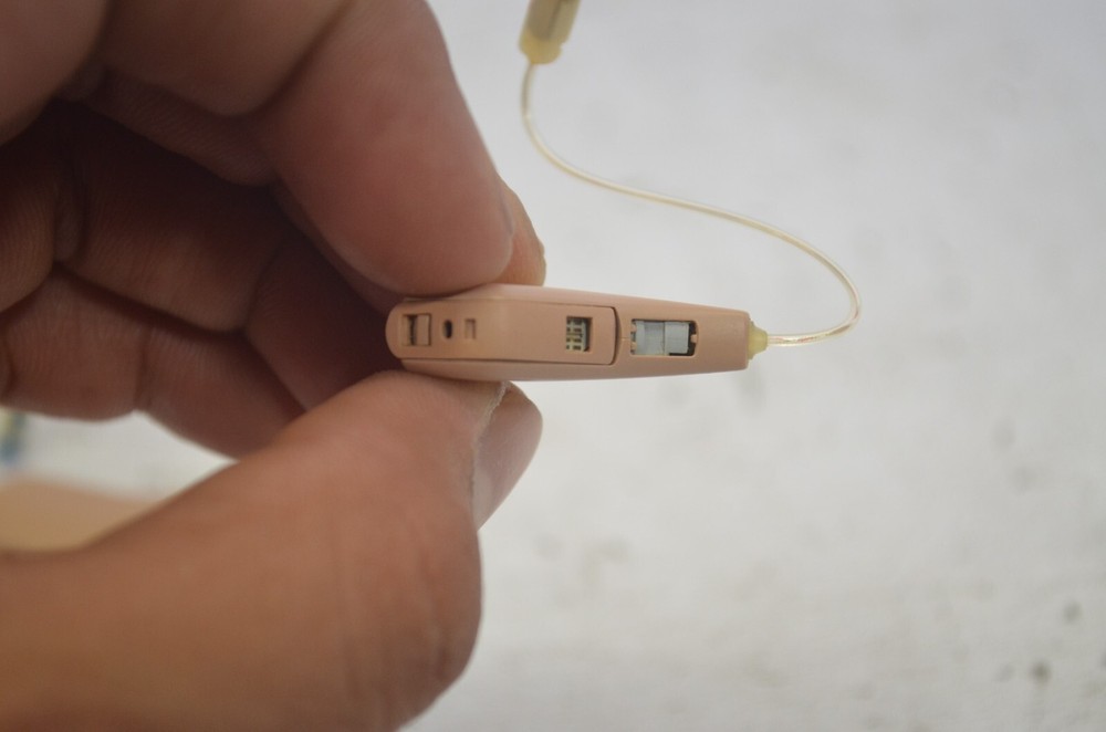 Resound Hearing Aids as is not tested missing button , might affect function