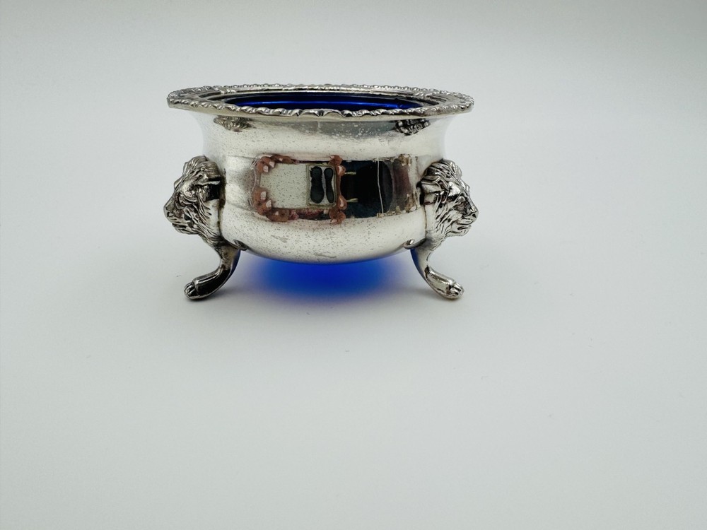 Vintage silver-plated salt cellar featuring ornate lion