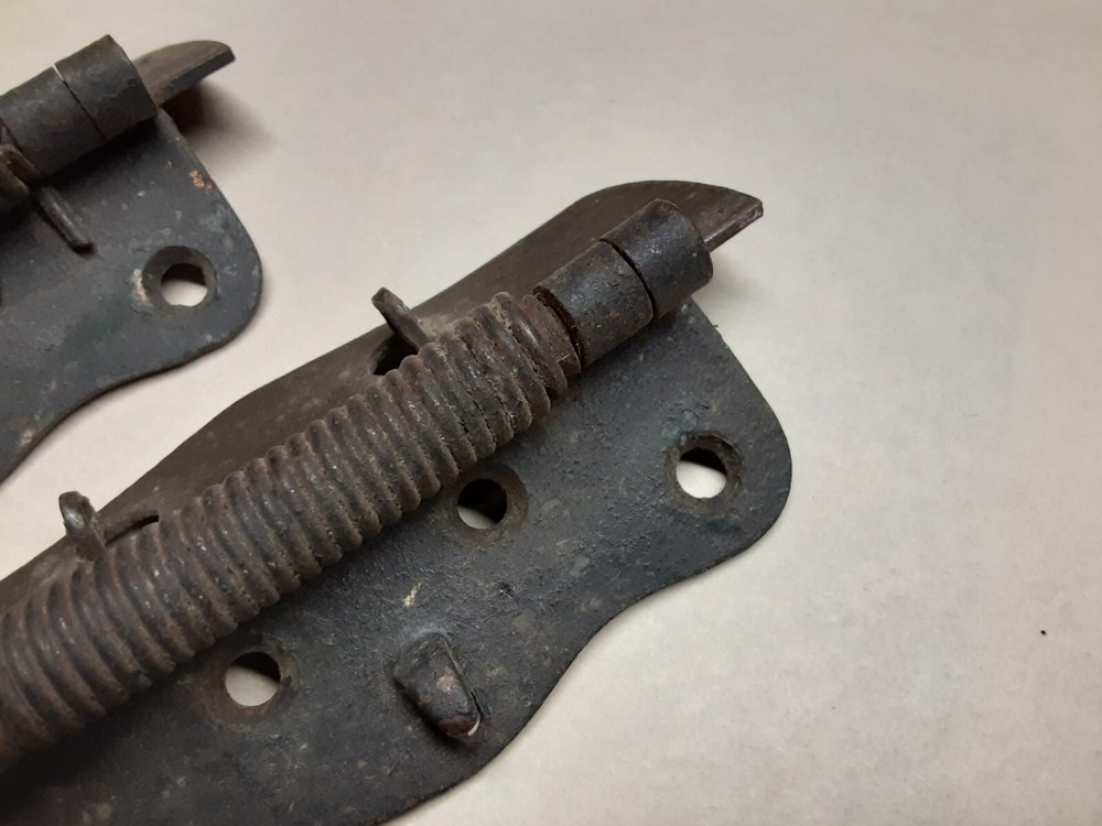 Pair of vintage spring loaded hinges
