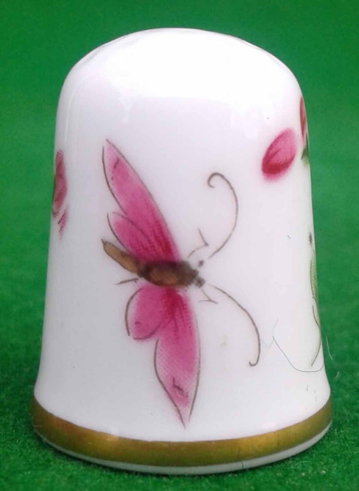 9 CAVERSWALL BONE CHINA THIMBLES.