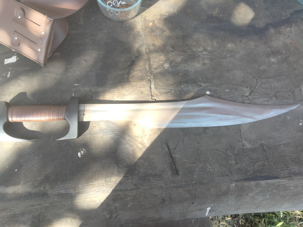 Unsharpened sword with carrying sheath and adjustable shoulder strap