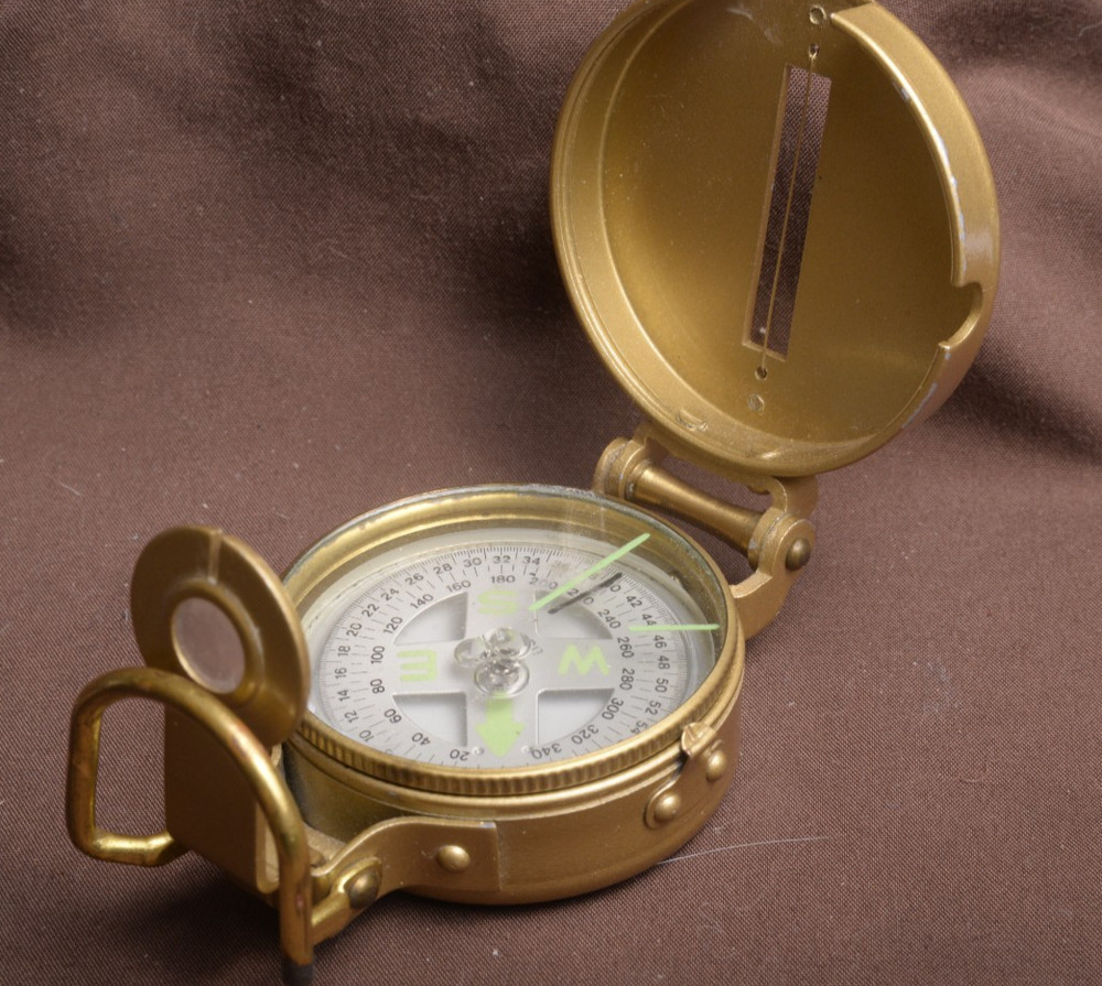 two lensatic compasses one with box