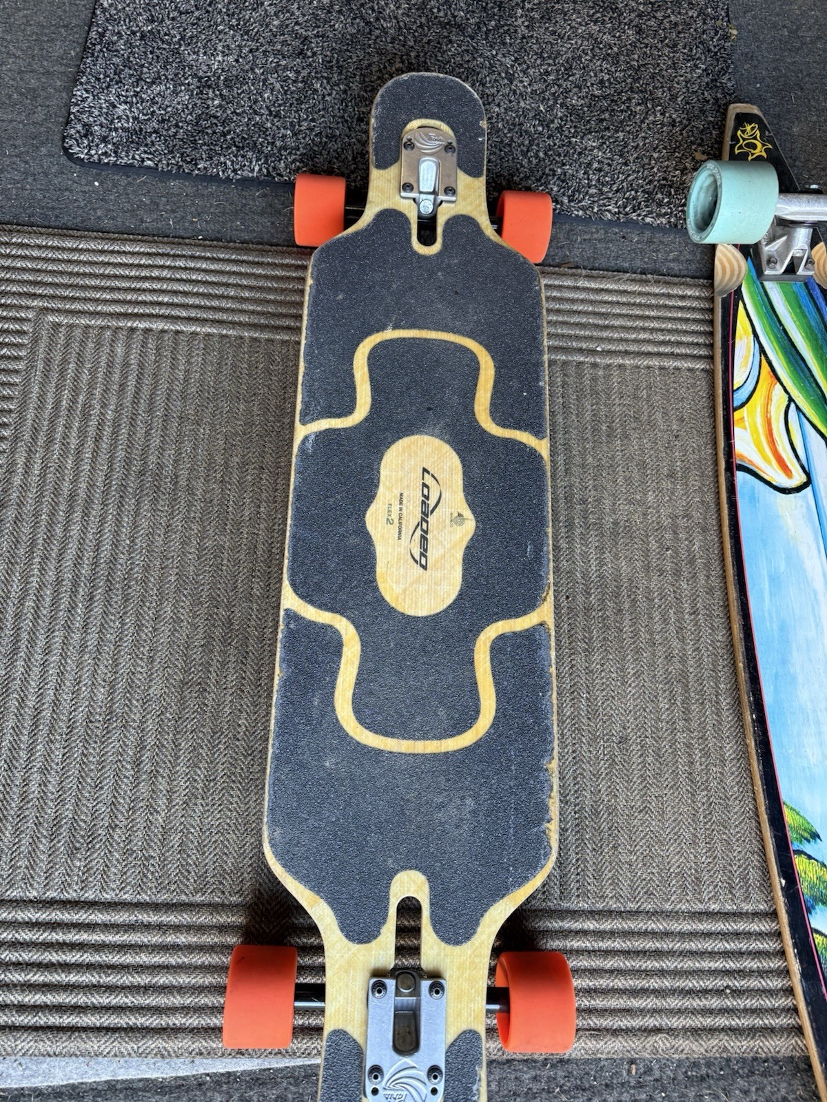 Loaded Tan Tien Drop Through Longboard Black Grip Tape Orange Wheels