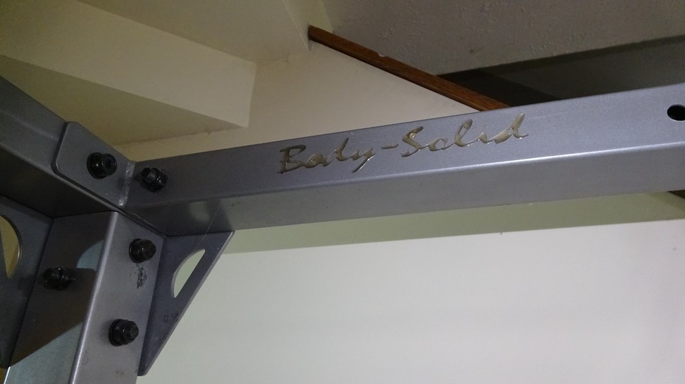 Body Solid power rack with pulley system for lifting weights - used