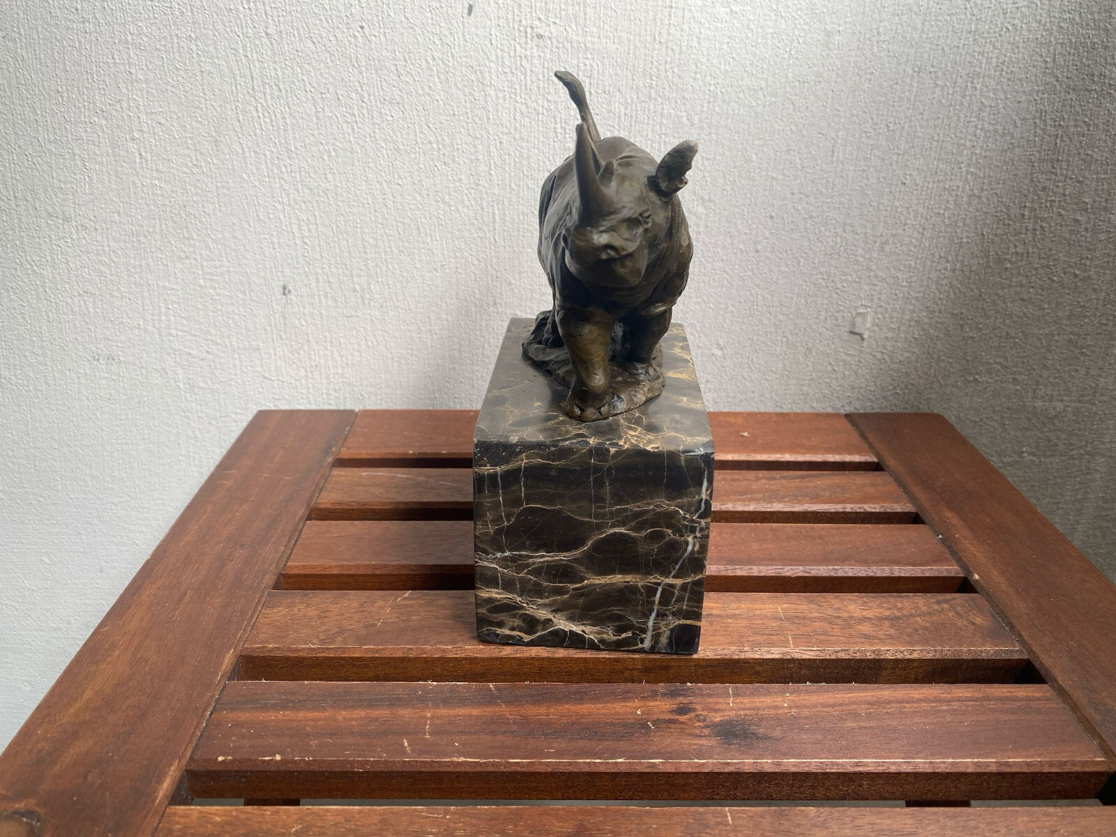 Bronze sculpture Walking Rhinoceros on a black marble base after Milo