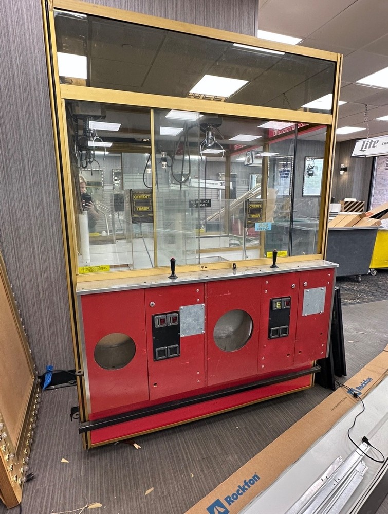 Clean sweep duel claw machine.   Arcade.   Double claw machine.