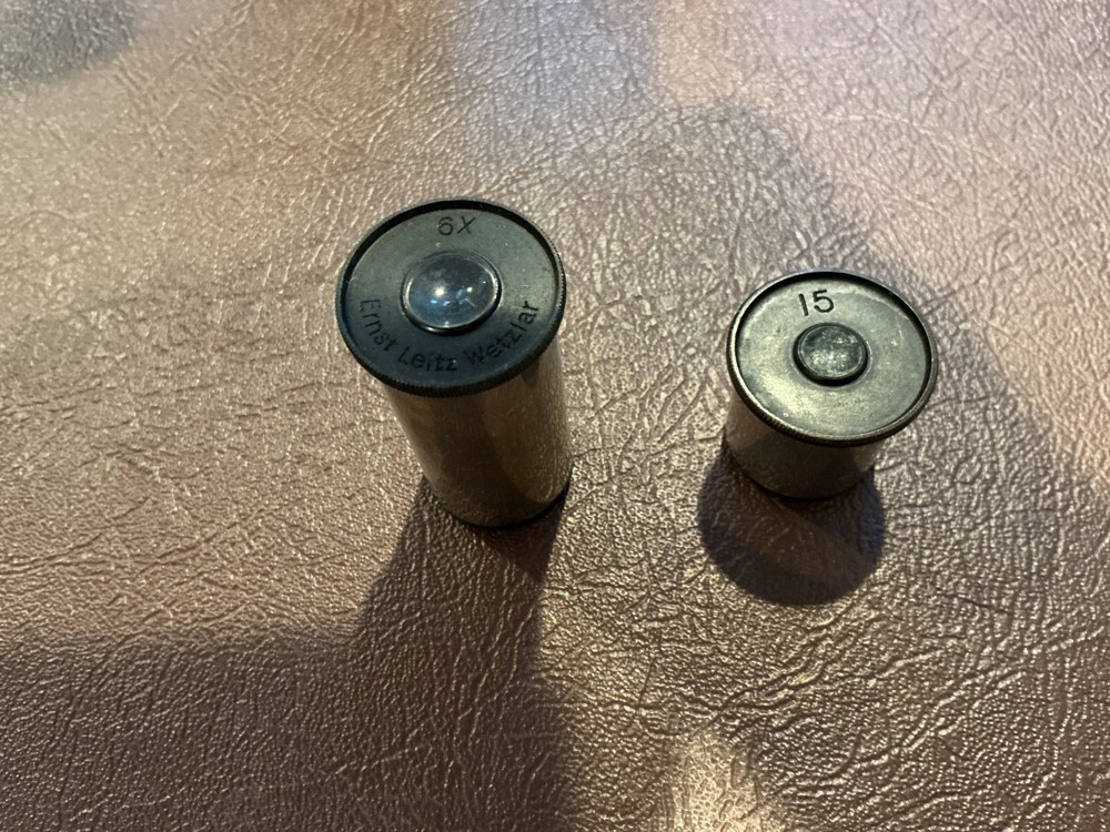 ERNST LEITZ MICROSCOPE WITH 3 OBJECTIVES AND CASE.