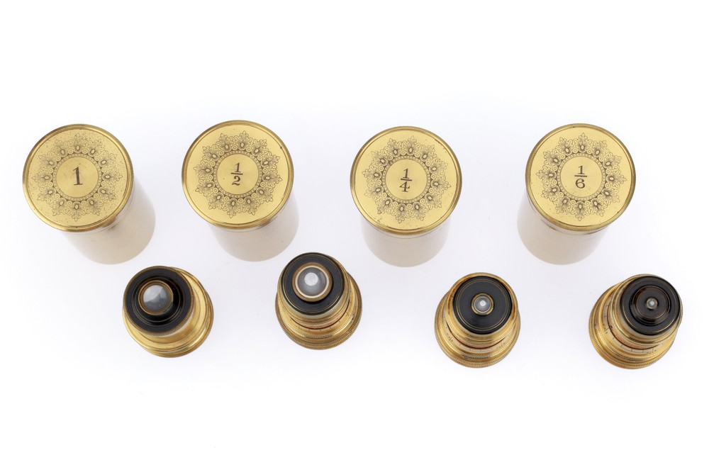 Very large binocular microscope in case with accessories.