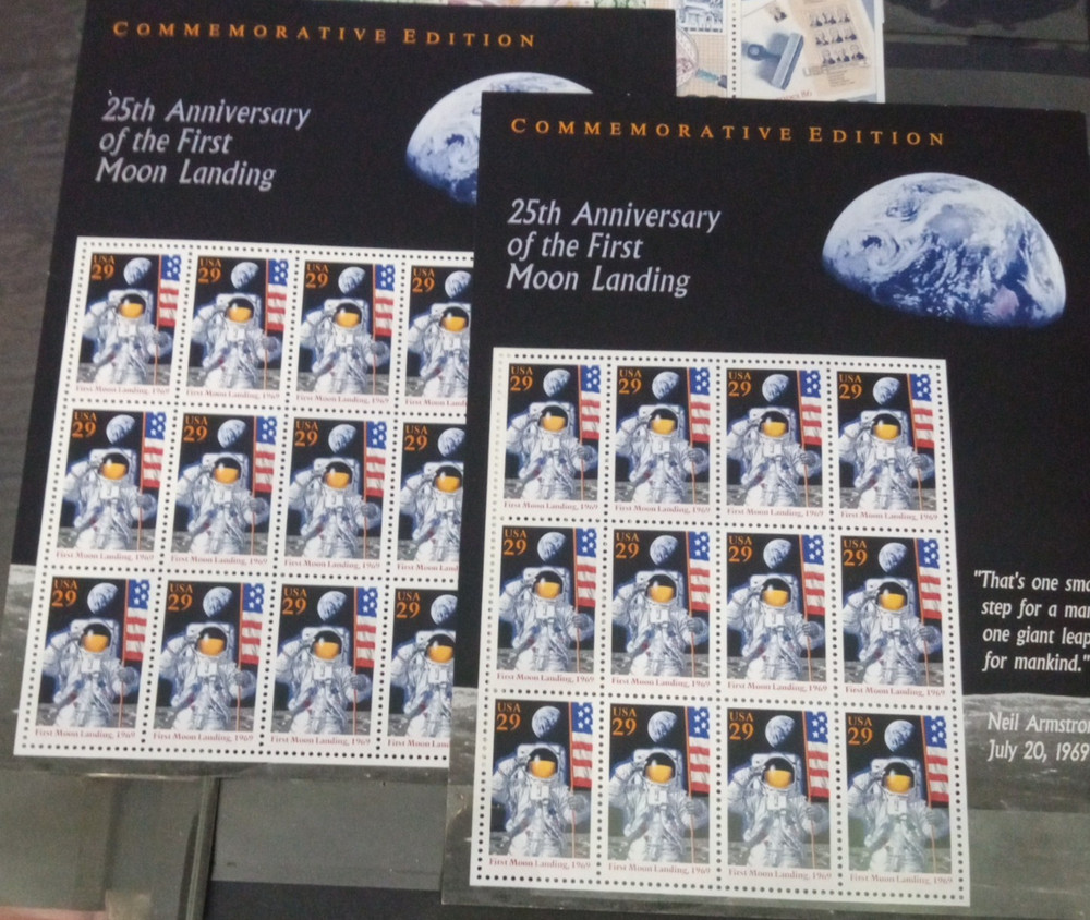 2" 3 ring binder w/ 5 pages of stamps over 100 usable stamps mostly US