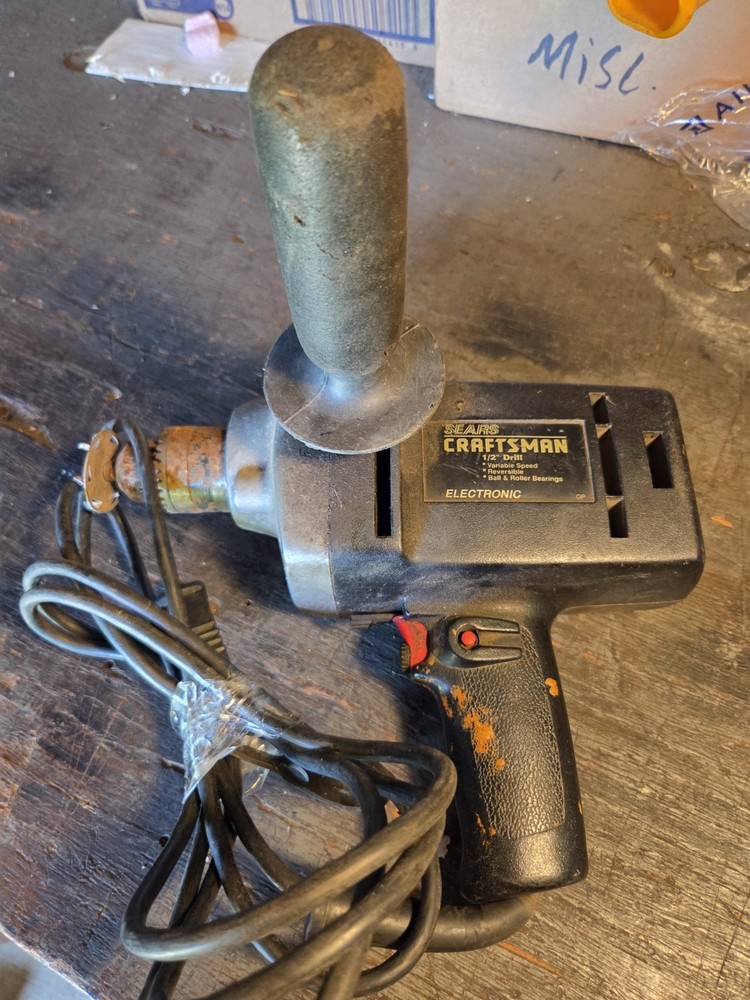 Sears Craftsman 1/2 Inch Reversible Variable Speed Drill with side handle.