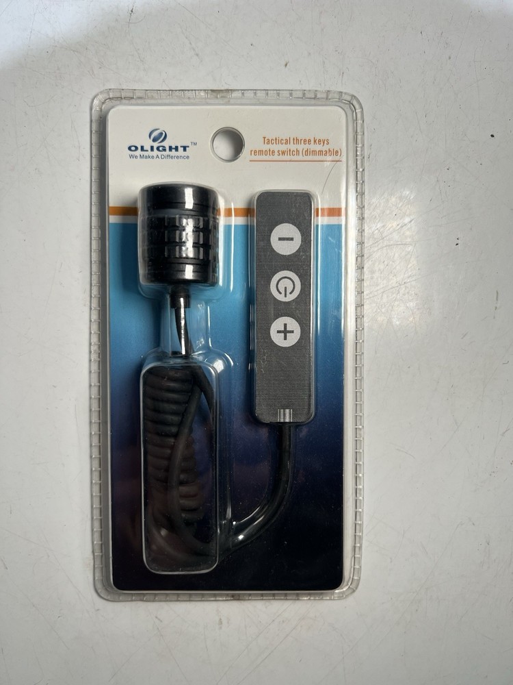 Olight tactical remote switch with keys.