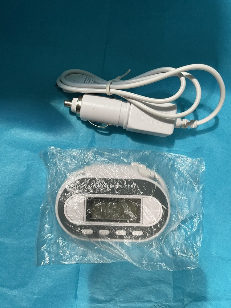 In Car FM Transmitter w Charger Model SP2202