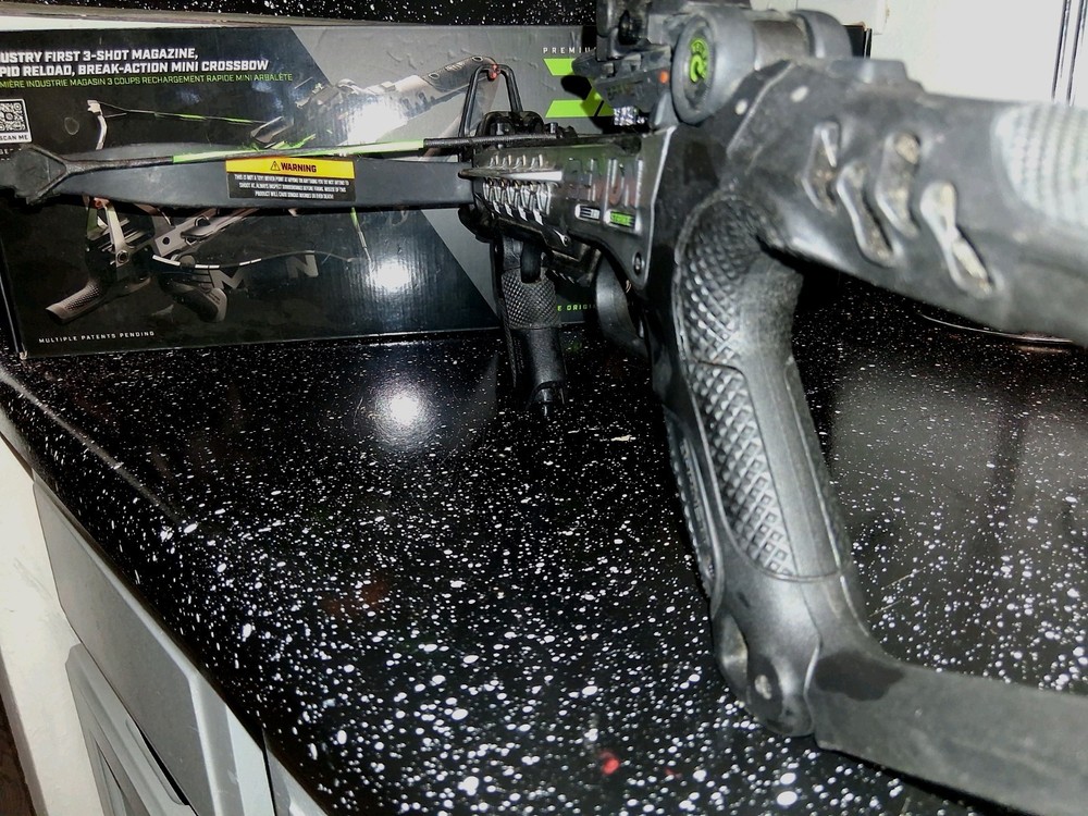 Black crossbow with green