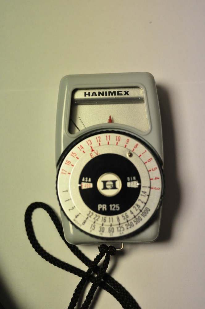 Hanimex model PR 125 light meter with strap and case.