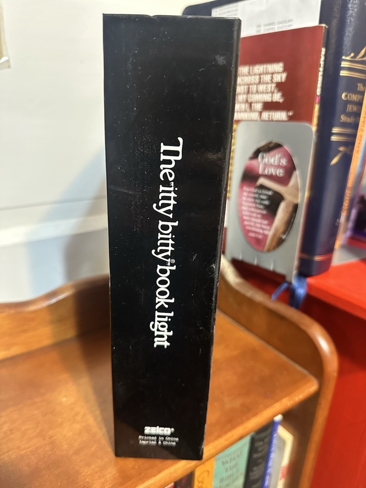 1980’s Original, The "itty bitty book light". Before LED lights