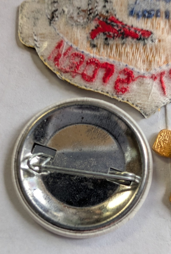 Operation Desert Storm pinback button, yellow ribbon pin, and patch