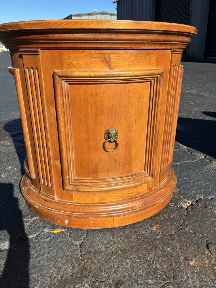 This Ethan Allen Tuscan Oval Cabinet Drum Table
