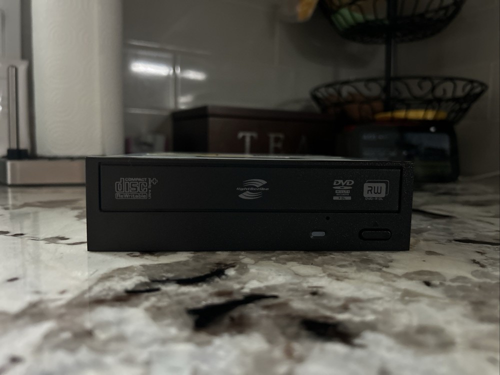 A Hitachi LG Data Storage Super Multi DVD Rewriter. Model GH4OL.