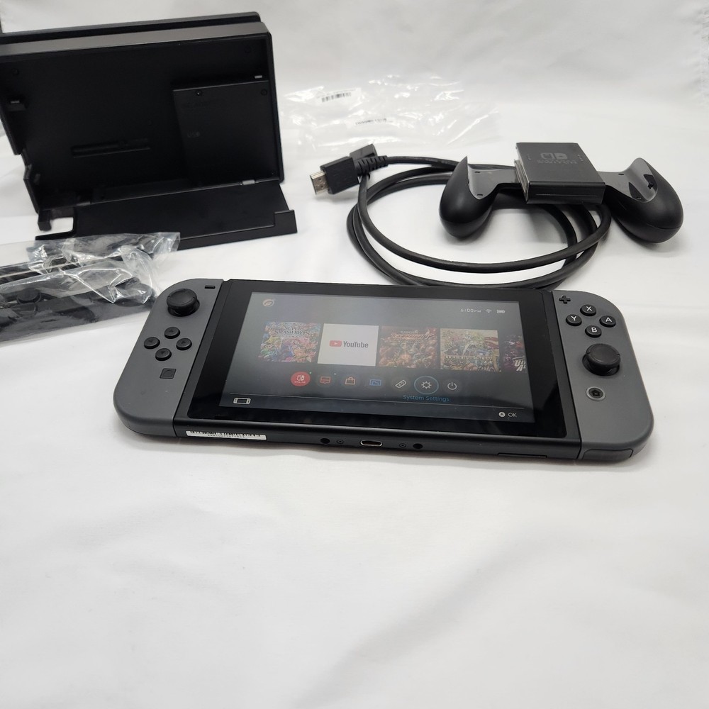 NINTENDO SWITCH MINT CONDITION INCLUDES JOYCONS WITH GRIP DOCK CHARGER HDMI