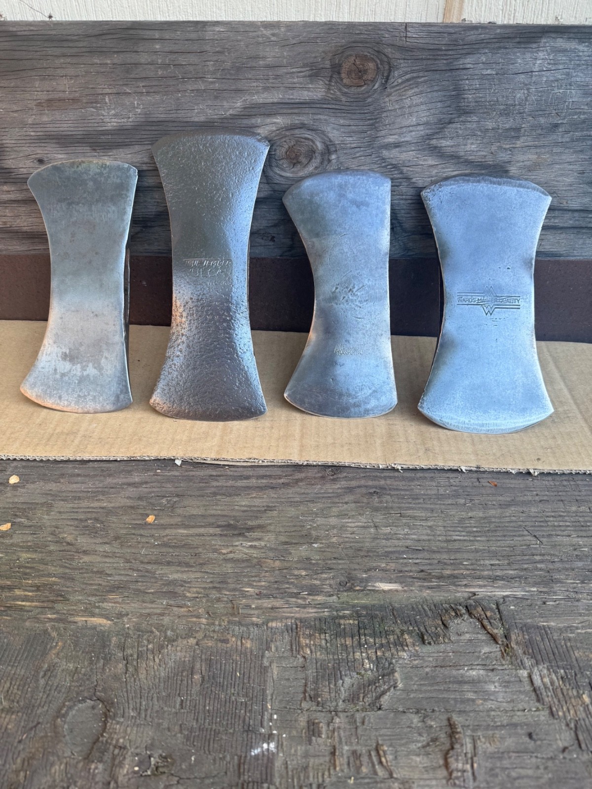 Vintage lot of 4 double bit axes.