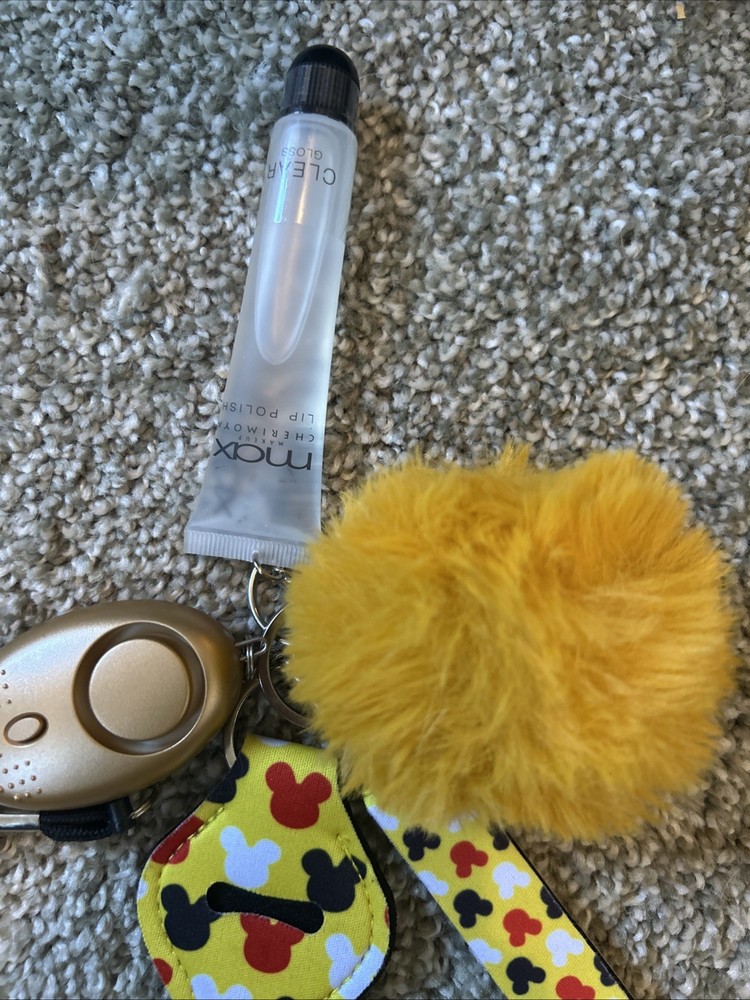 personal safety keychain set with several attached accessories.