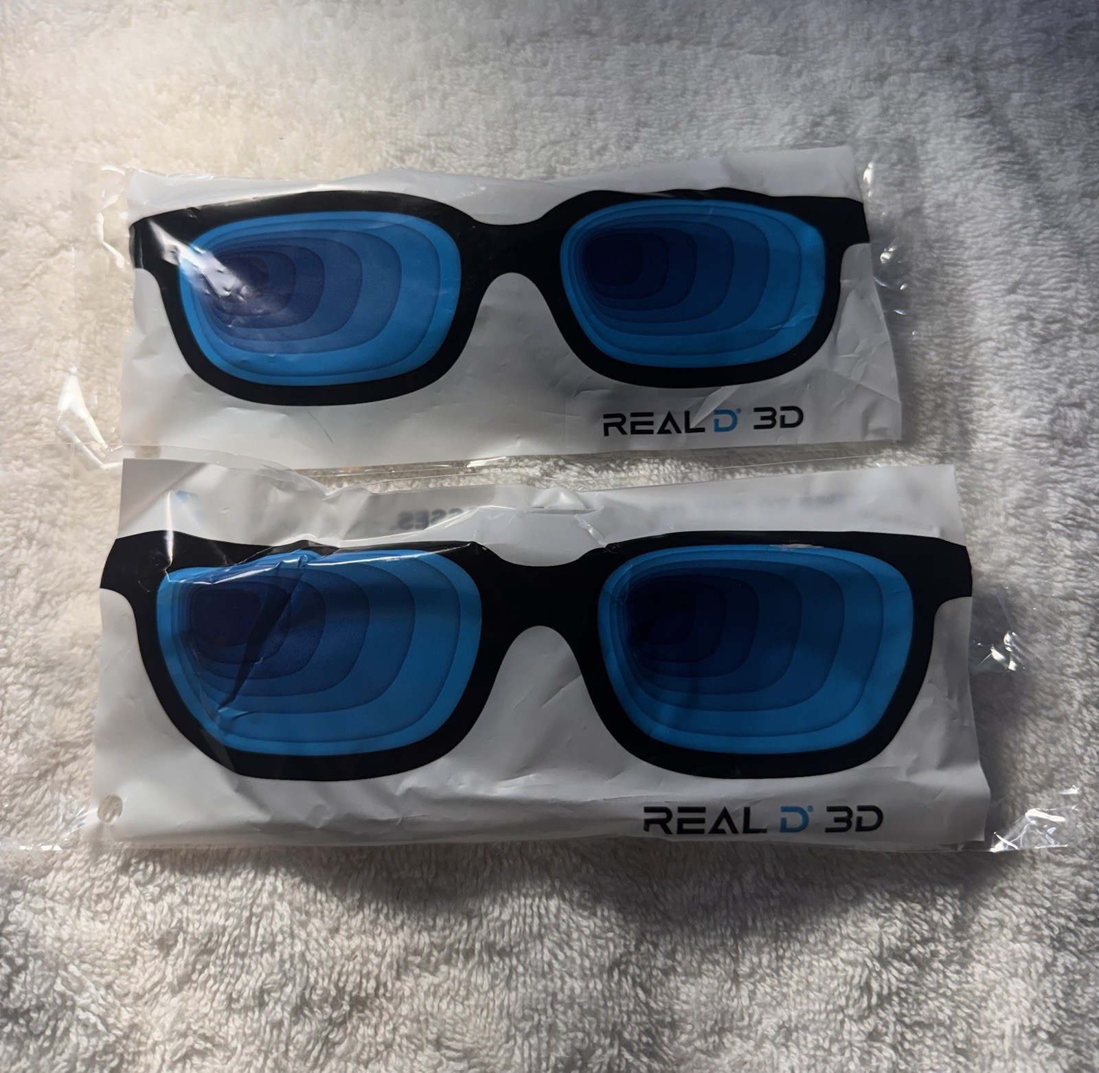 2 PACKAGES REAL 3D MOVIE GLASSES ONE SIZE FITS ALL NEW SEALED