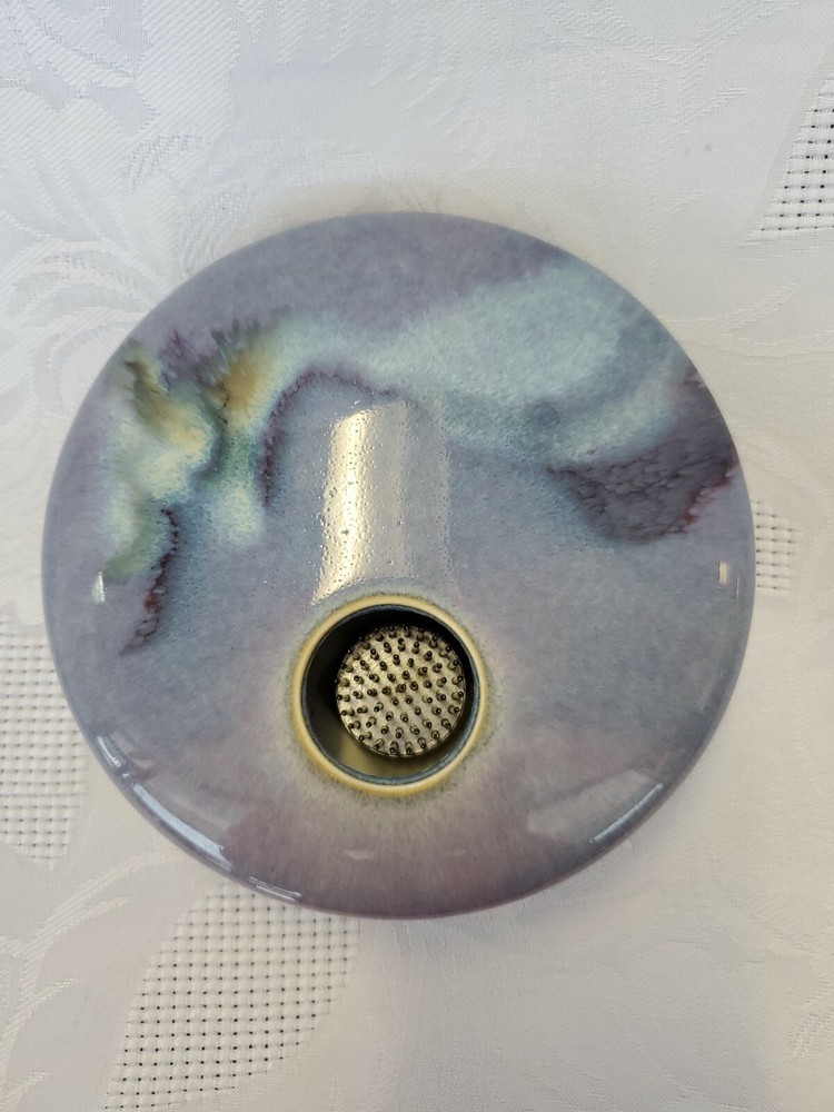 Ceramic single flower bud display vase.