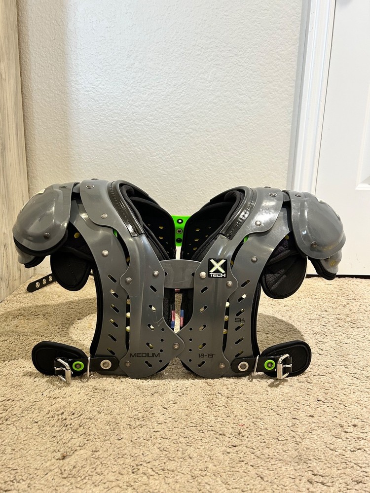 XTECH Medium shoulder pads (Football) comes with size small backplate.