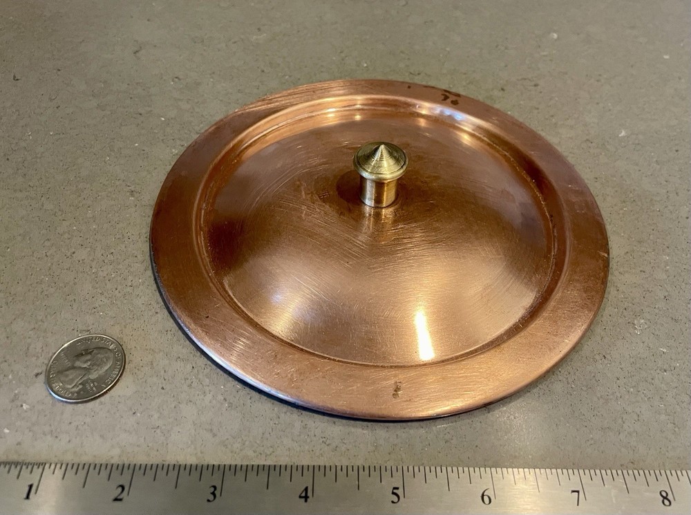 Antique copper lid.